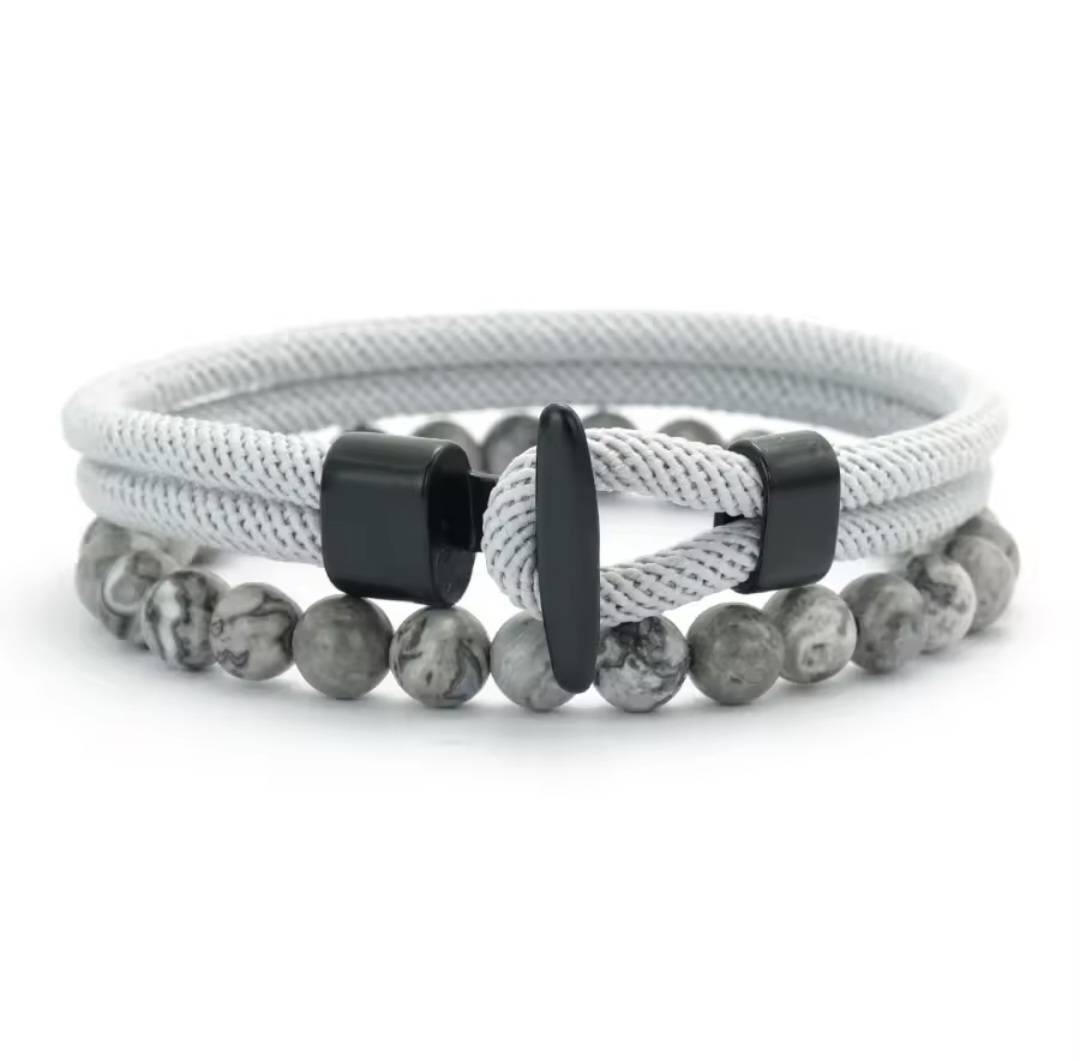 Double layer stone bracelet by GIORGIO MARENO featuring smooth stones and adjustable clasp on a neutral background.